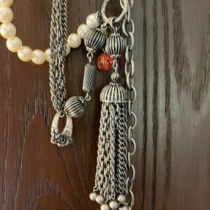 Women’s double chain belt. One of metal objects and the second chain of pearls.